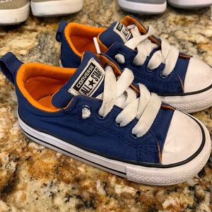 Blue and orange converse shoes